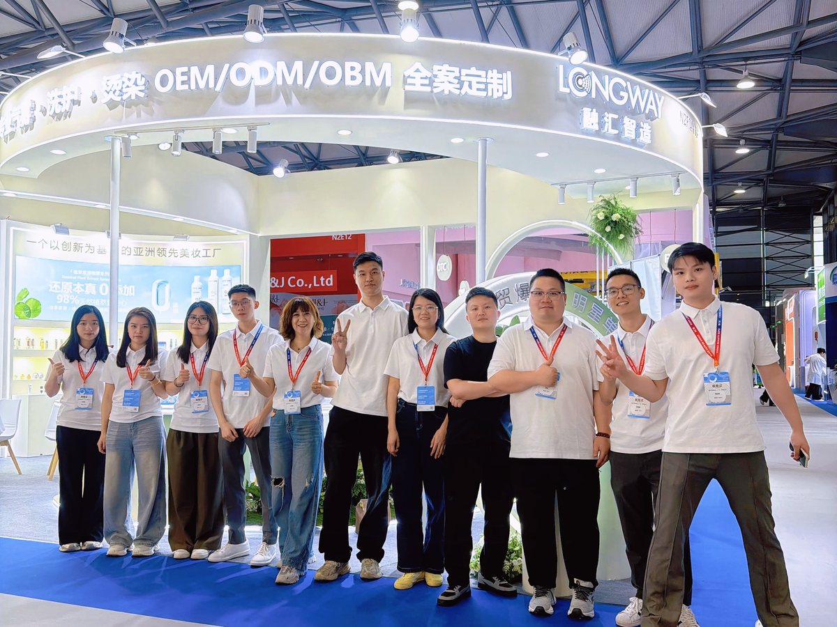 LONGWAY team group photo at the company booth during a beauty trade show