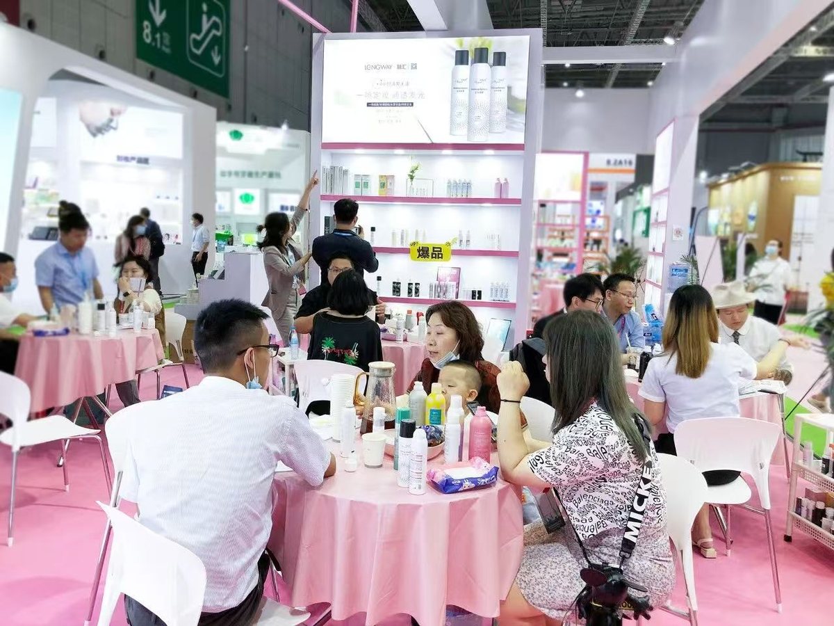 LONGWAY exhibition booth with visitors discussing private label projects